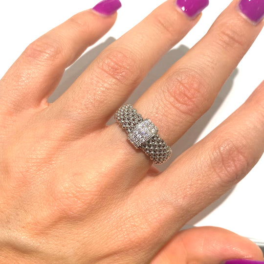 ANELLO A MAGLIA CON TRE FILE DI ZIRCONI