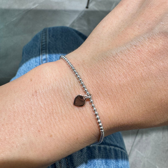 BRACCIALE SFERE E CUORE PENDENTE