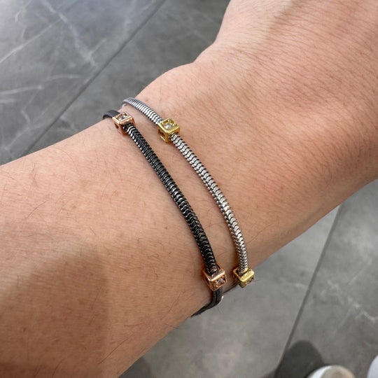 BRACCIALE IN ARGENTO CON TRE DADINI DORATI