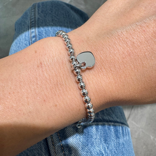 BRACCIALE SFERE E CUORE PENDENTE